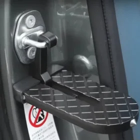 Person using car door step to access SUV roof – car roof rack step ksa